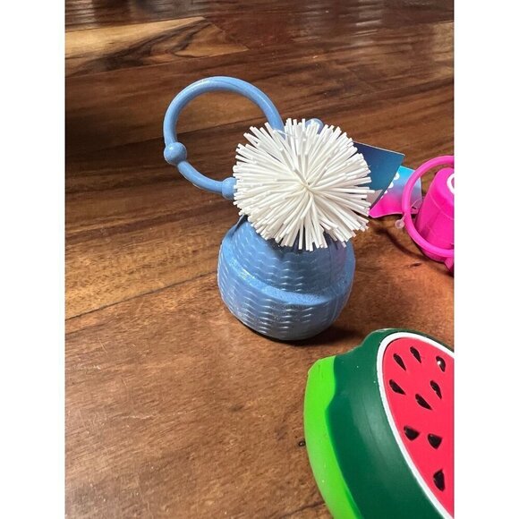 Lot of 6 hand sanitizer cases.  Good vibes, hat, bag, donut, melon - Picture 6 of 6